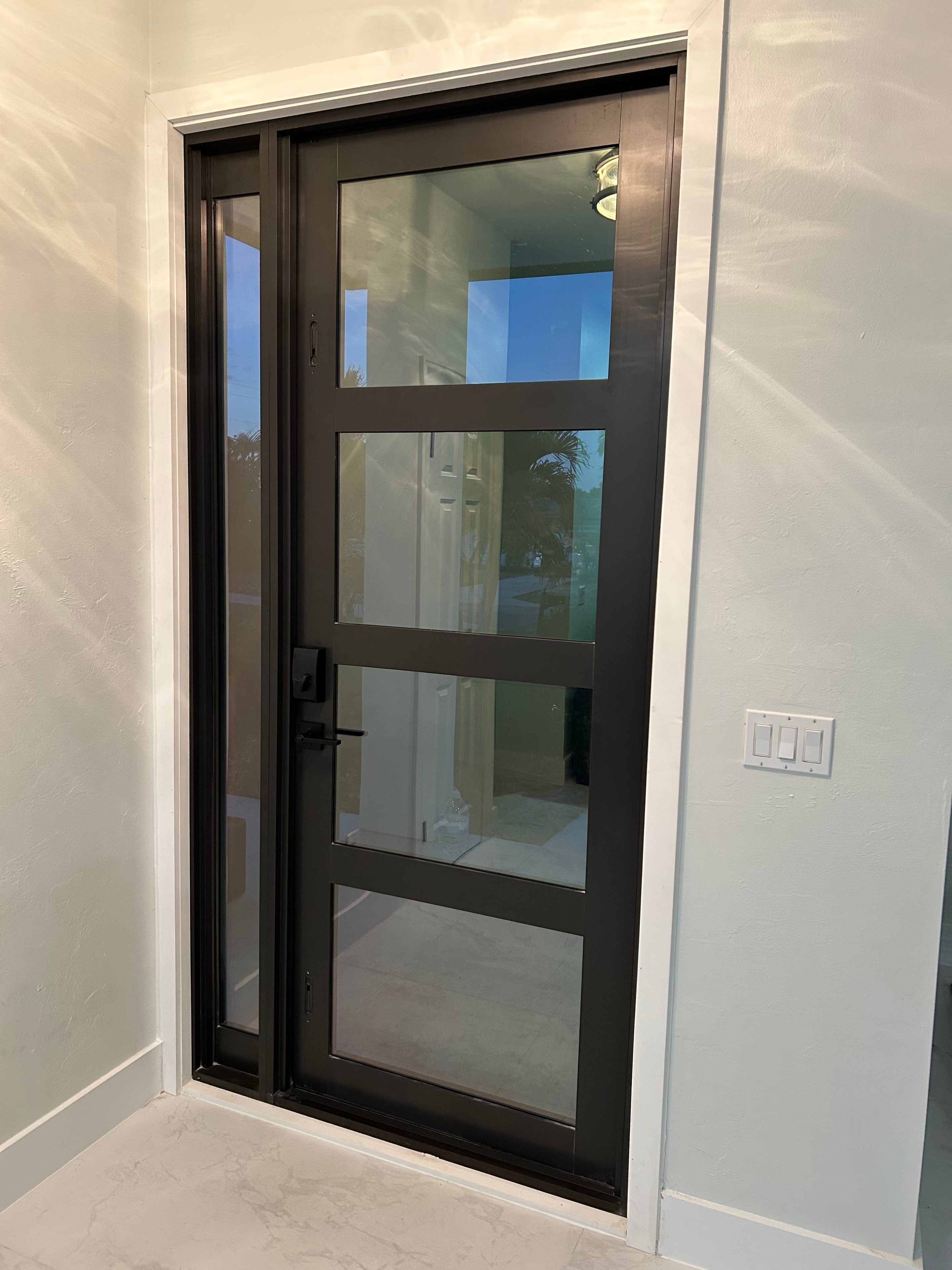 Mr. Doorman project — black glass door with sidelite